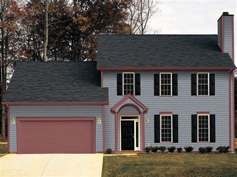 grey house black metal roof|dark grey brick house.